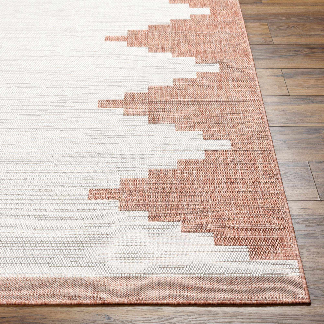 Rug with geometric pattern on a wooden floor

Djugun Peach Fuzz Indoor & Outdoor Area Rug