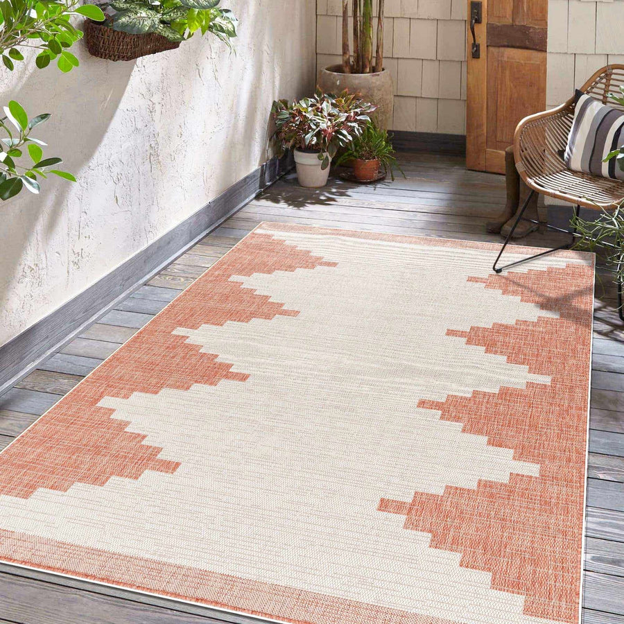Patterned rug on a wooden deck with plants and a chair in the background

Djugun Peach Fuzz Indoor & Outdoor Area Rug