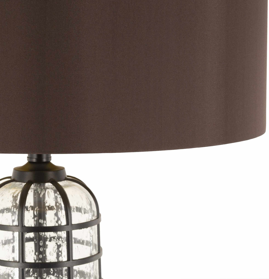 Lamp with brown shade and clear cage base on a white background

Binuatan Floor Lamp