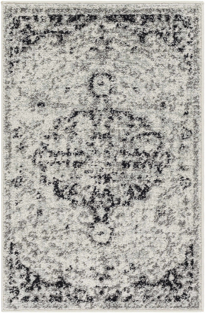 Gray and black patterned rug with a central design

Bodrum Gray Area Rug