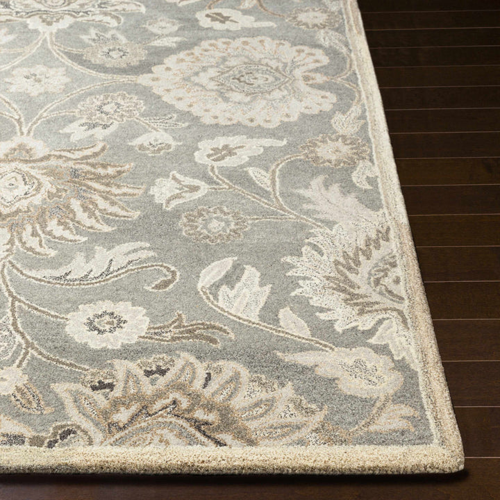 Close-up of a floral patterned rug on a wooden floor

Conesus 1195 Hand Tufted Ivory & Taupe Wool Rug