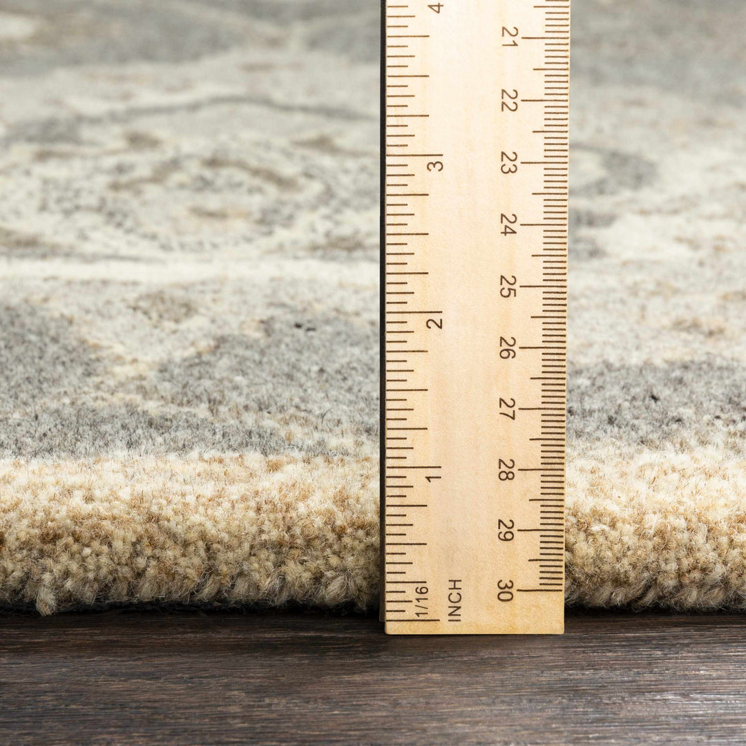 Rug with a wooden ruler showing measurements on a wooden surface

Conesus 1195 Hand Tufted Ivory & Taupe Wool Rug