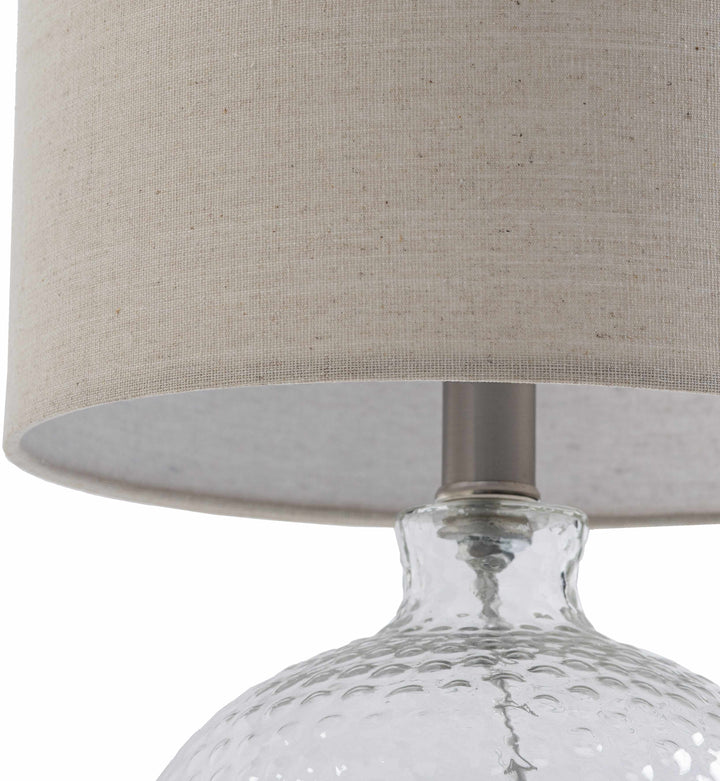 Table lamp with textured glass base and beige fabric shade on a white background

Enetai Glass White Table Lamp
