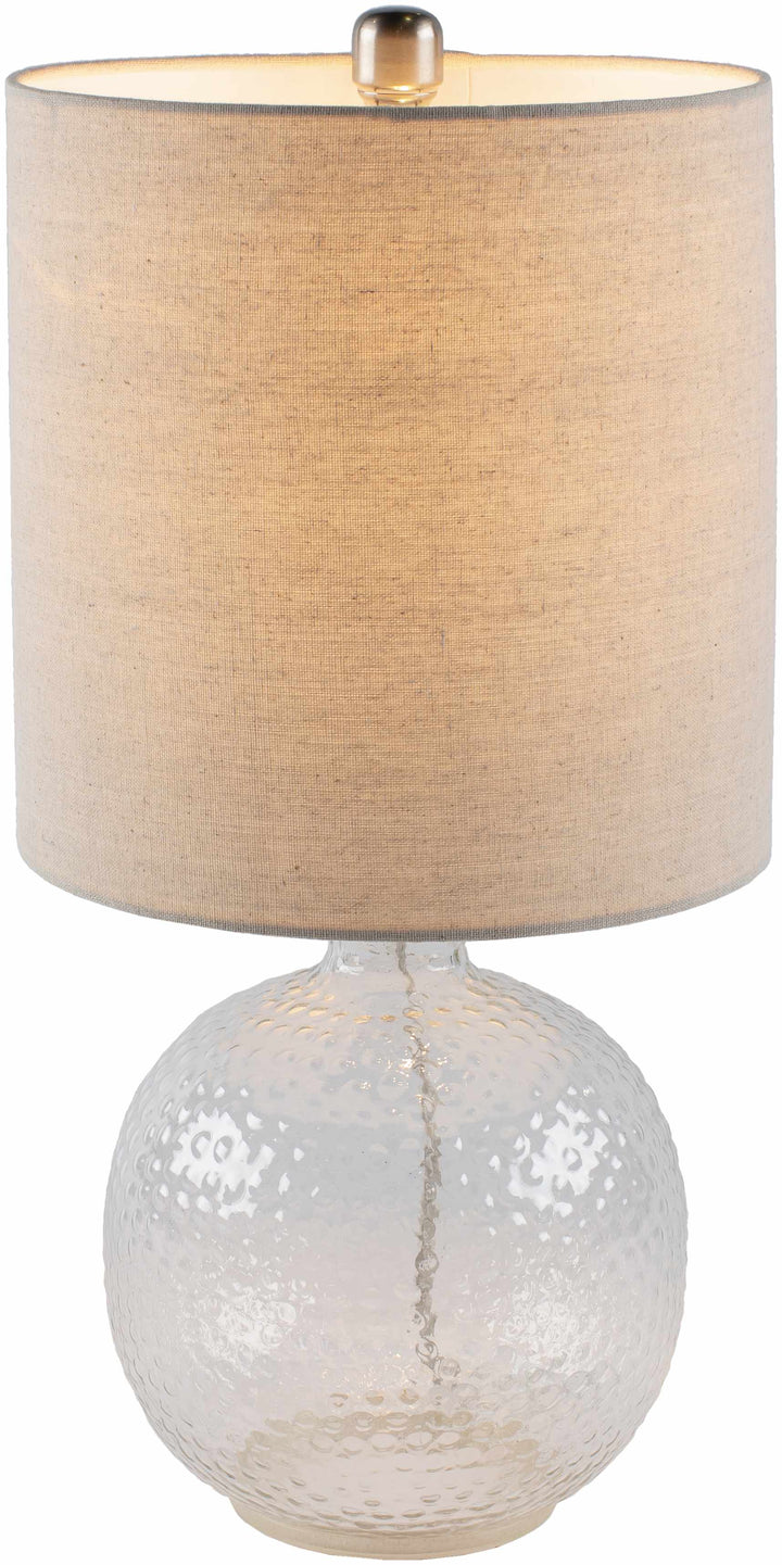 Table lamp with textured beige shade and white ceramic base on a white background

Enetai Glass White Table Lamp