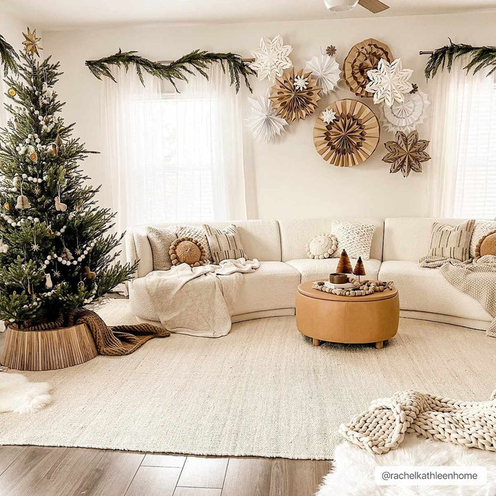 Cozy living room decorated for Christmas with a tree, garlands, and festive decorations.

Iantha Jute Rug