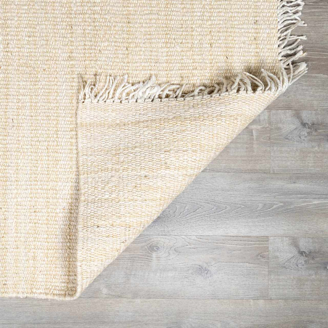Beige woven rug on a wooden floor

Iantha Jute Rug