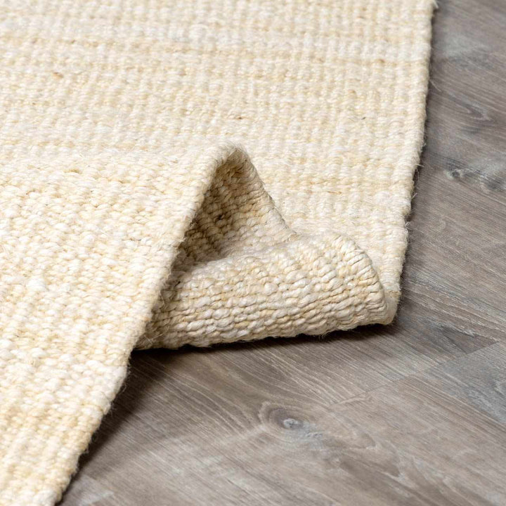 Beige textured rug on a wooden floor

Iantha Jute Rug