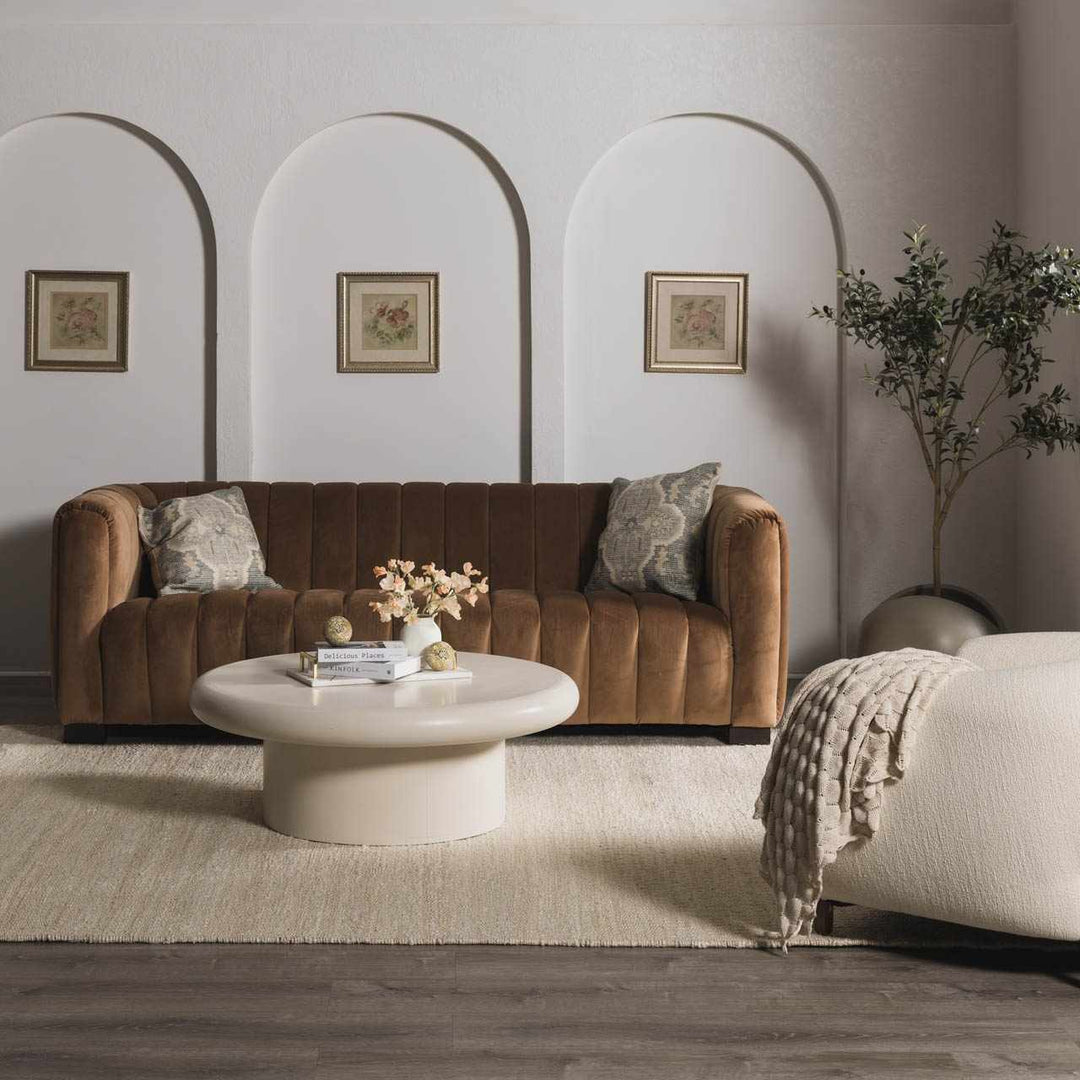 Living room with brown sofa, white coffee table, and decorative elements.

Iantha Jute Rug
