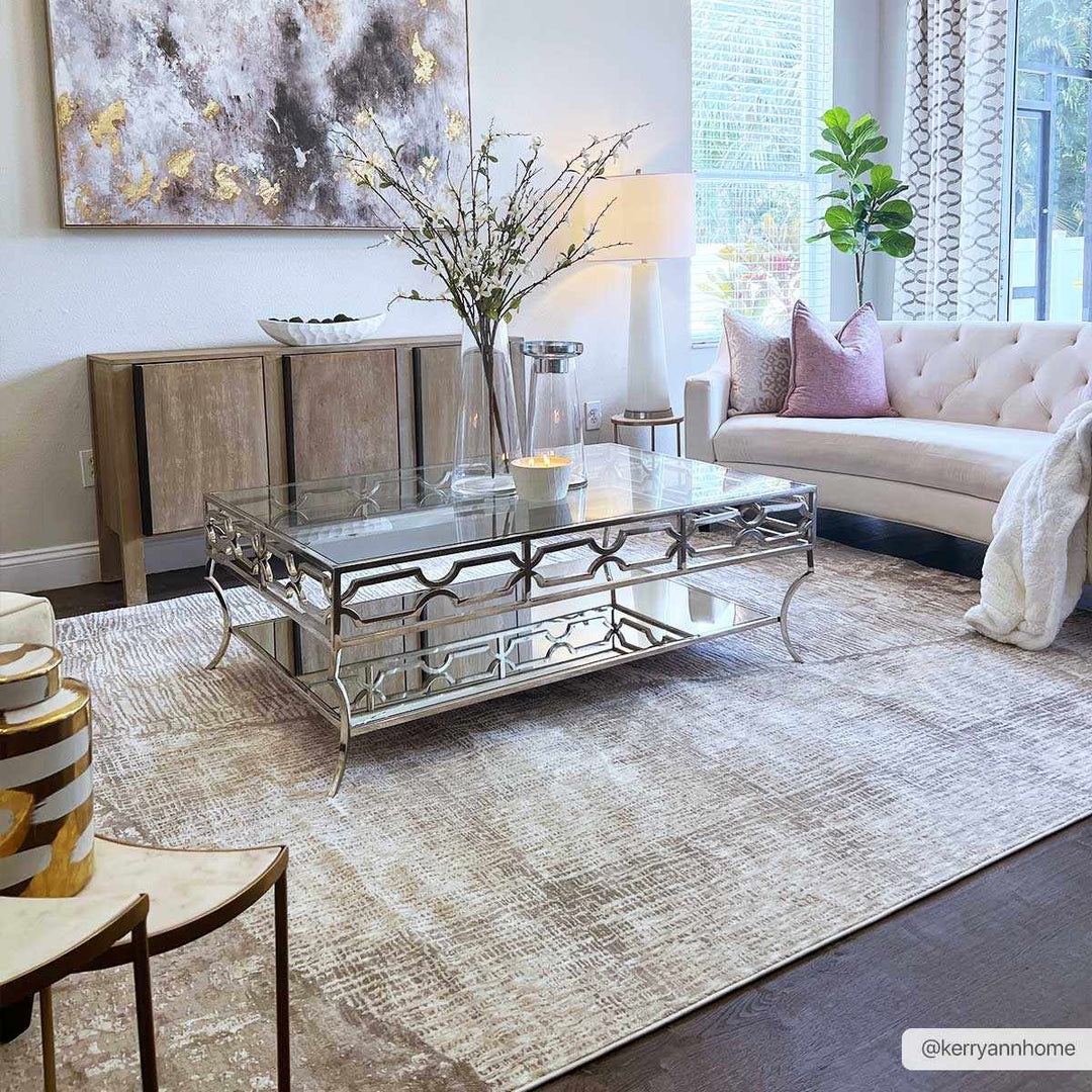 Modern living room with a glass coffee table, decorative rug, and abstract art.

Leeco Textured Luxe Rug