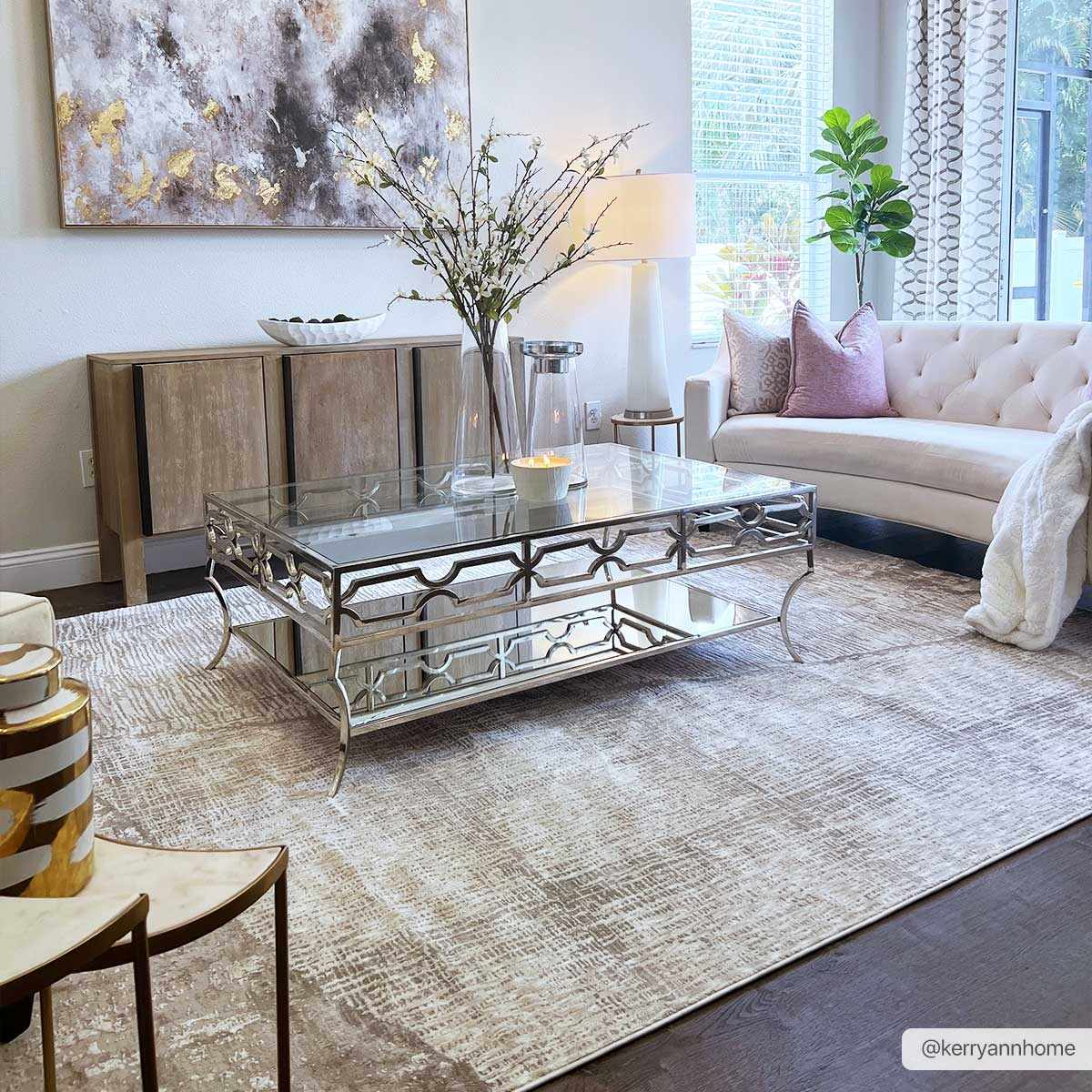 Modern living room with a glass coffee table, decorative rug, and abstract art.

Leeco Textured Luxe Rug