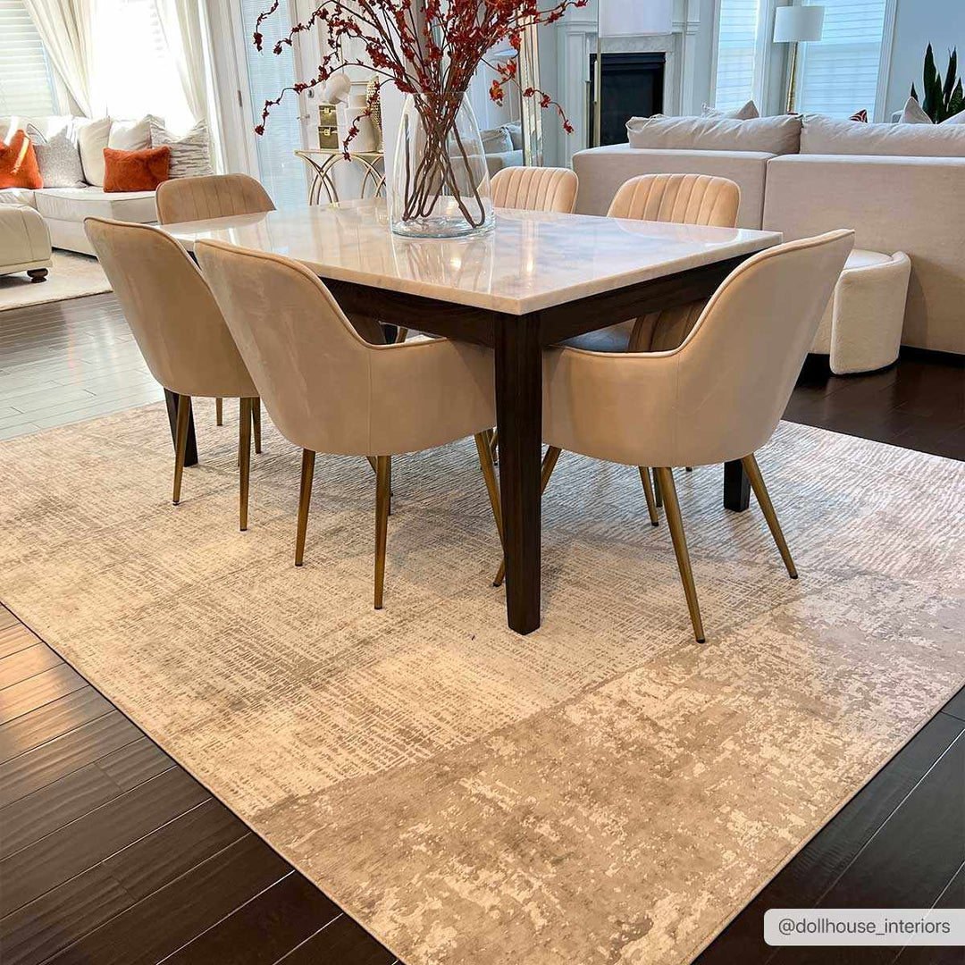 Dining room with a table and chairs on a patterned rug, surrounded by a living room.

Leeco Textured Luxe Rug