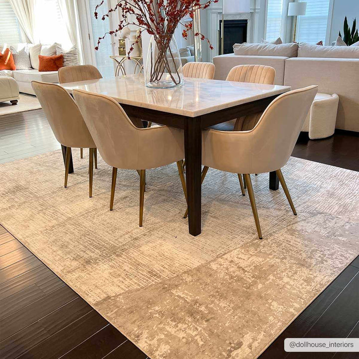 Dining room with a table and chairs on a patterned rug, surrounded by a living room.

Leeco Textured Luxe Rug