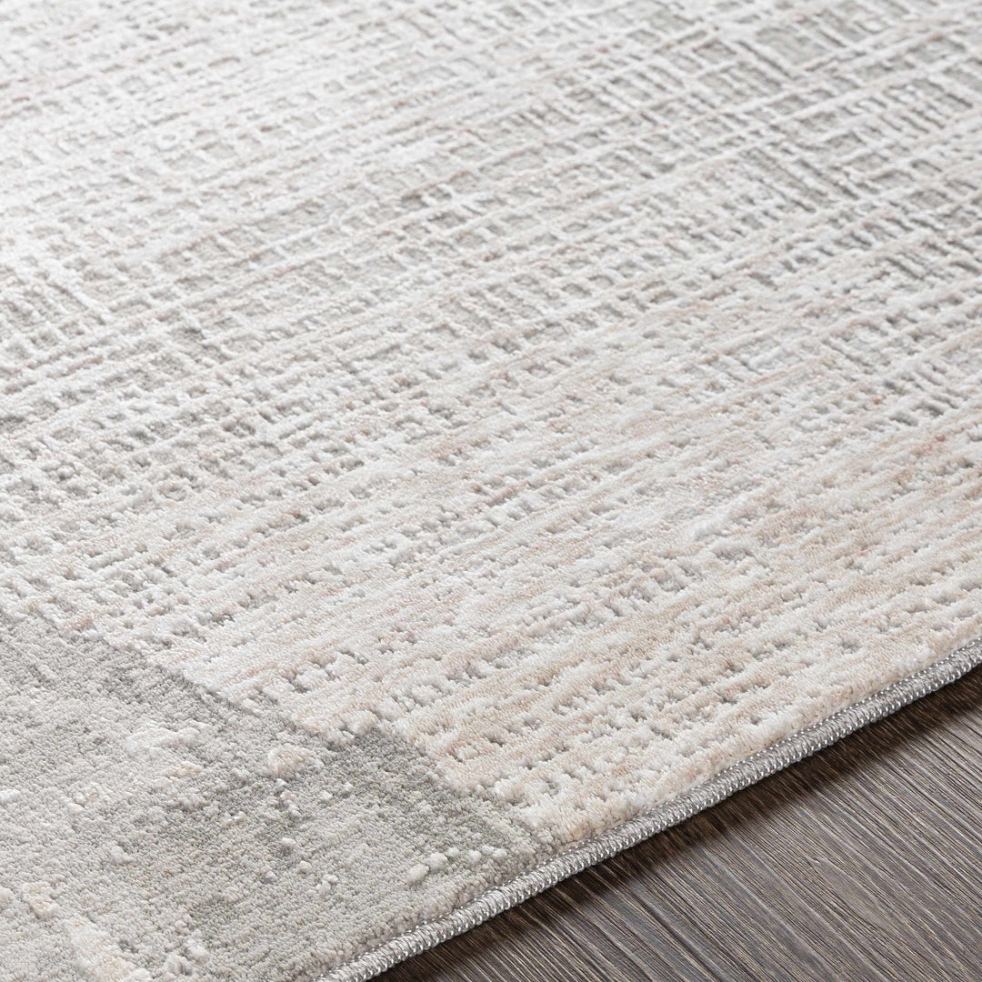 Close-up of a textured gray rug on a wooden floor

Leeco Textured Luxe Rug