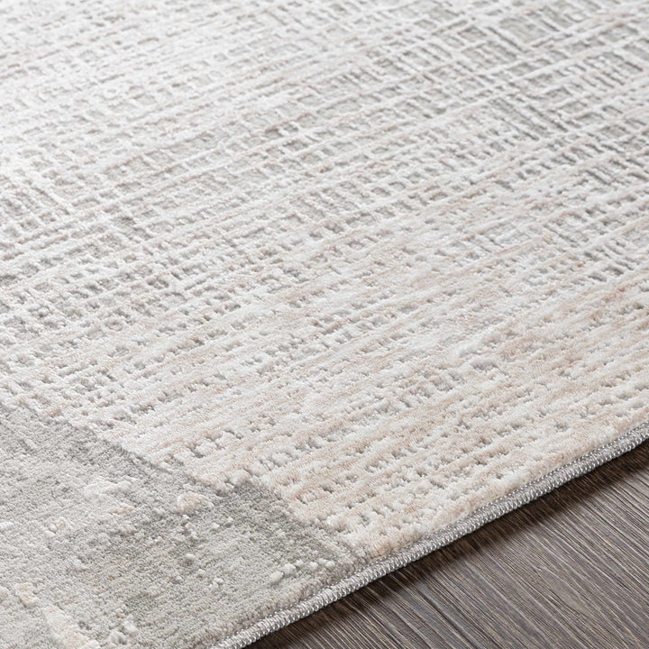 Close-up of a textured gray rug on a wooden floor

Leeco Textured Luxe Rug