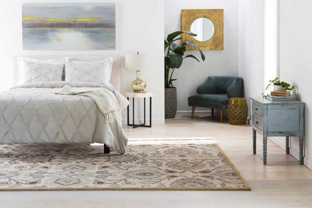 Modern bedroom with a bed, rug, and decorative items.

Yellow Ceramic Side Table