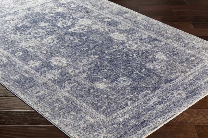 Blue and gray patterned rug on a wooden floor

Eastham Luxe Area Rug