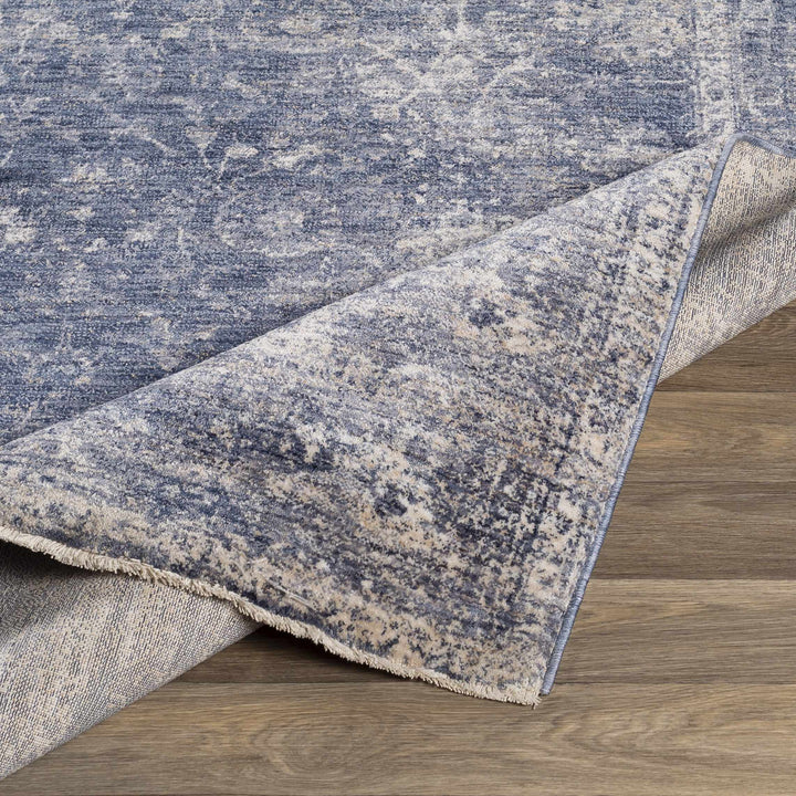 Textured blue and gray area rug on a wooden floor

Eastham Luxe Area Rug