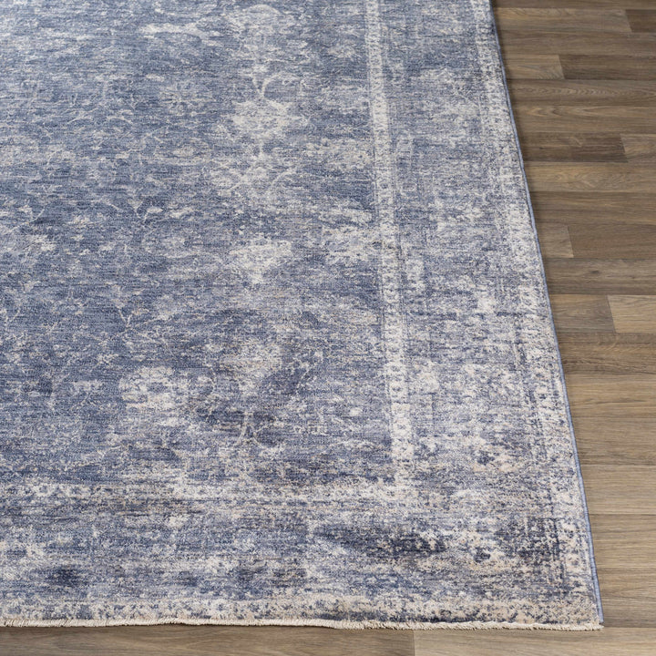 Blue and gray textured rug on a wooden floor

Eastham Luxe Area Rug