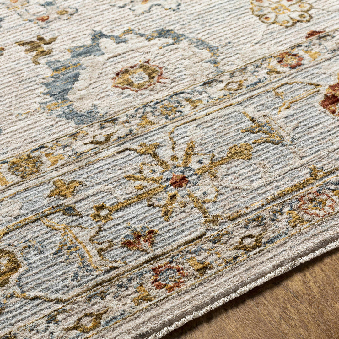 Close-up of a patterned rug with floral designs on a wooden floor.

Mogul Luxe Oushak Rug