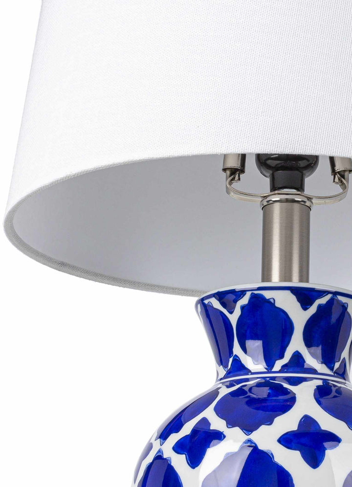 Table lamp with blue and white patterned base and white shade on a white background

Pangian White & Blue Patterned Ceramic Table Lamp