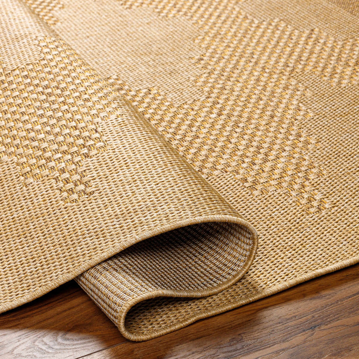 Close-up of a beige woven rug on a wooden floor

Colum Flatweave Faux Jute Rug