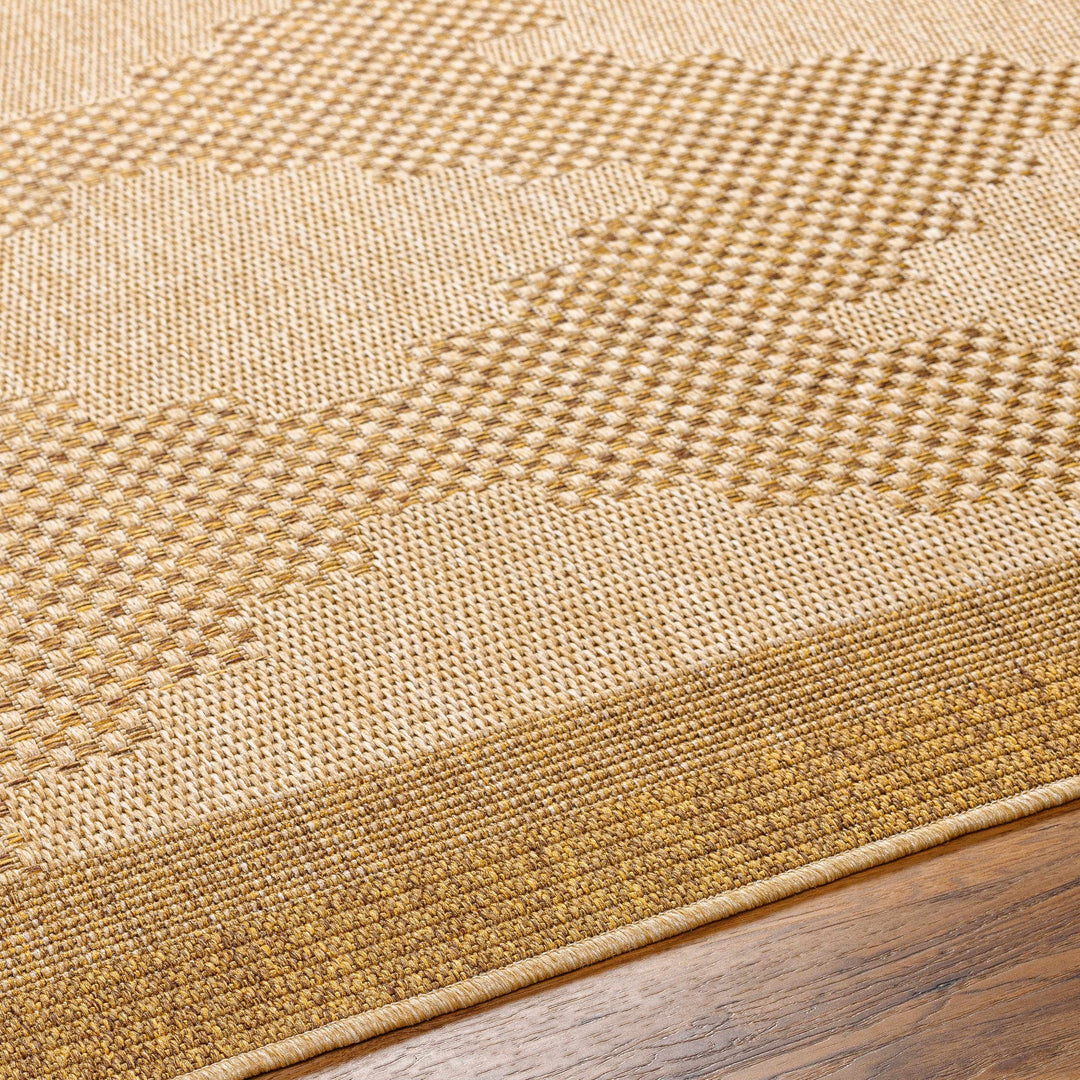 Close-up of a textured beige rug on a wooden floor

Colum Flatweave Faux Jute Rug