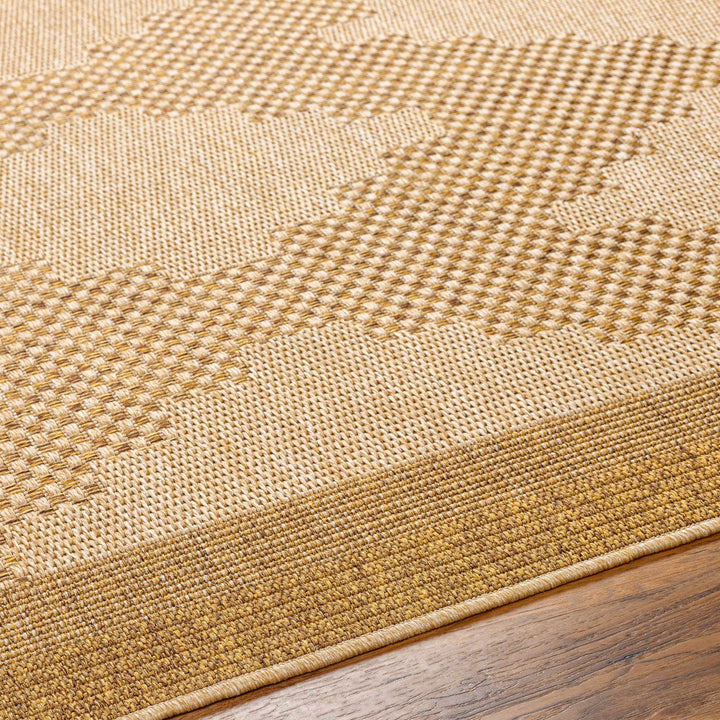 Close-up of a textured beige rug on a wooden floor

Colum Flatweave Faux Jute Rug