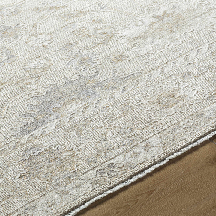 Close-up of a textured beige rug on a wooden floor

Vaman Luxe Rug