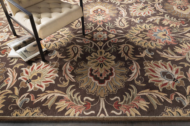 Decorative floral-patterned rug with intricate design on a dark brown background