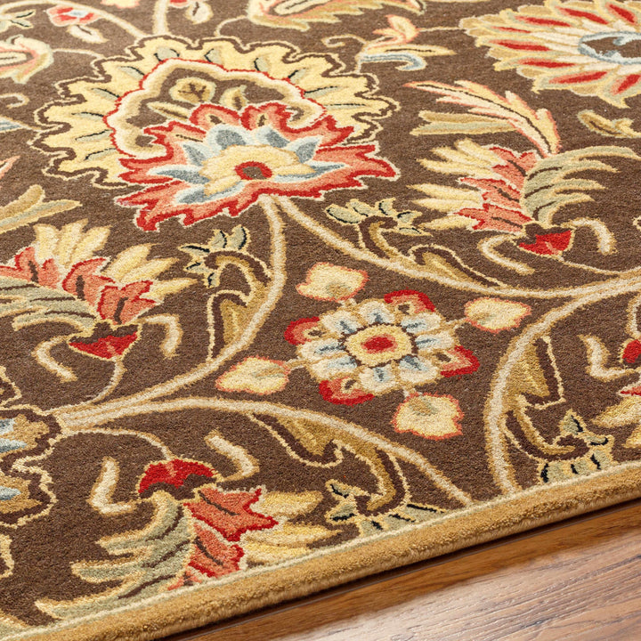 Close-up of a floral patterned rug on a wooden floor