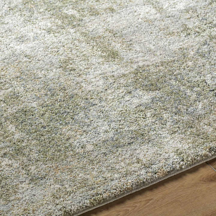 Textured green rug on a wooden floor

Zazie Thick Luxe Rug